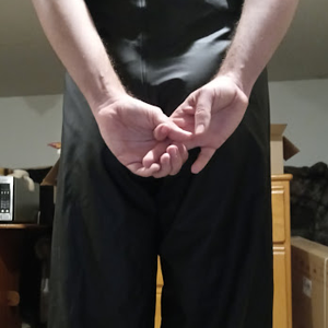 Me in my Medium Black Helly Hansen Polyester Pants w/my hands behind my back (back, close-up)