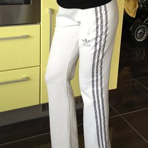 Adidas womens white pants black stripes front pose