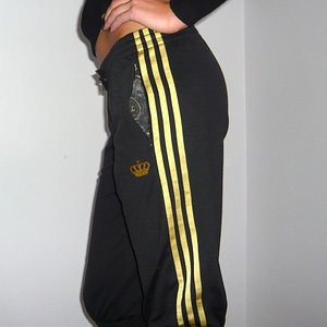 Adidas womens black gold stripes side photo