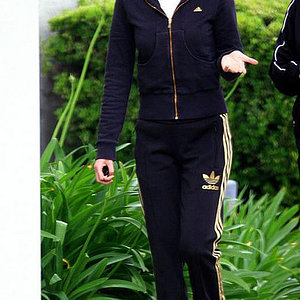 Adidas womens black track suit gold stripe