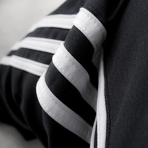 Adidas womens black stripe closeup