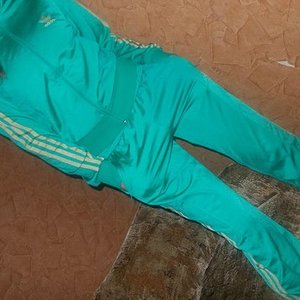 Adidas womens teal track suit angle