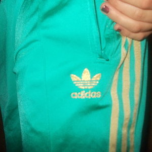 Adidas womens teal track suit pockets