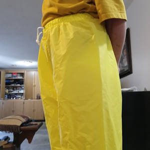 Me in my yellow shirt & my NEW yellow nylon pants w/my hands behind my back (side 1)