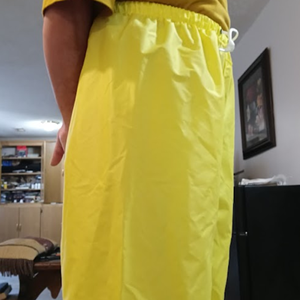 Me in my yellow shirt & my NEW yellow nylon pants w/my hands behind my back (side 2)