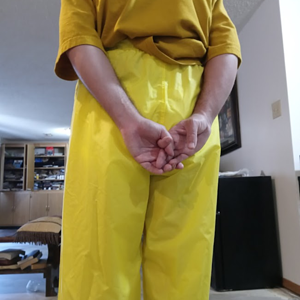 Me in my yellow shirt & my NEW yellow nylon pants w/my hands behind my back (back)