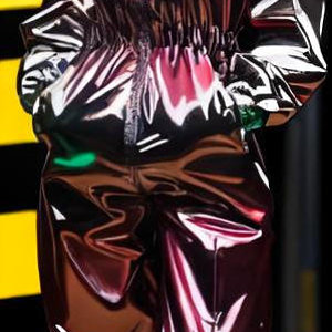 Woman in pink metal shellsuit