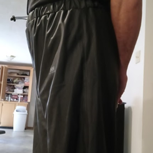 Me with my hands behind my back in my Black Shirt & Black Polyester Pants (side)