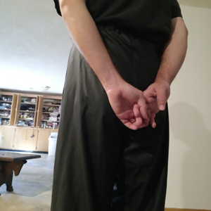 Me with my hands behind my back in my Black Shirt and Black Polyester Pants (back)