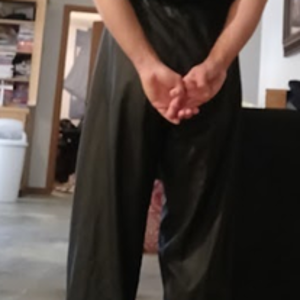 Me with my hands behind my back in my Black Shirt and Black Polyester Pants (back 2)