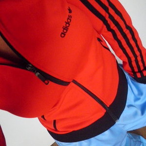 Adidas womens red sporty jacket angle