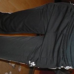 Adidas black pants side angle stand