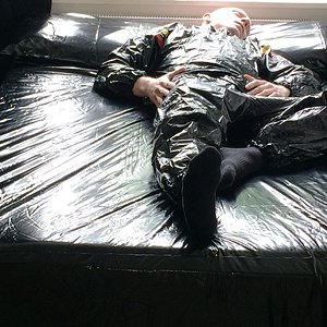Black Plastic Sauna Suit on PVC Bedding