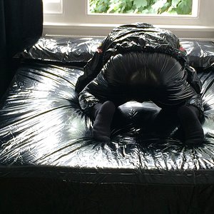 Black Plastic Sauna Suit on PVC Bedding