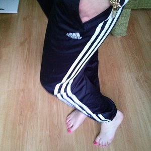 Girl with black/white adidas pants