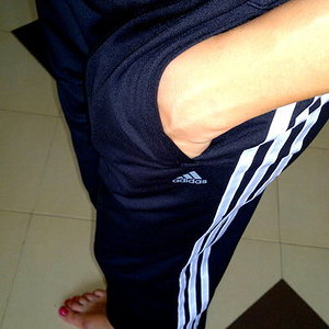 Girl with black/white adidas pants