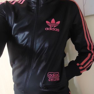 Girl in black/pink Adidas Chile outfit