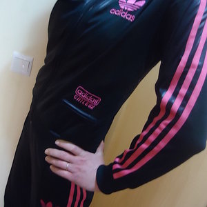 Girl in black/pink Adidas Chile outfit
