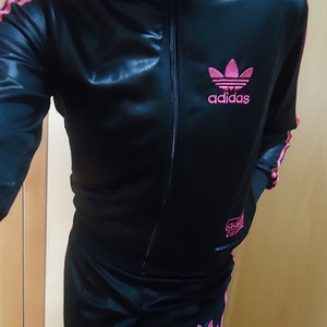 Girl in black/pink Adidas Chile outfit