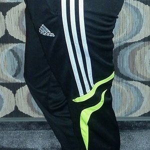 Girl with black/white adidas pants