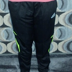 Girl with black/white adidas pants