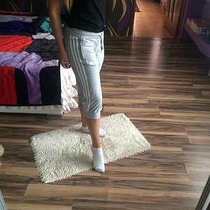 Girl with grey/white adidas pants