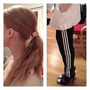 Girl with black/white adidas pants and heels