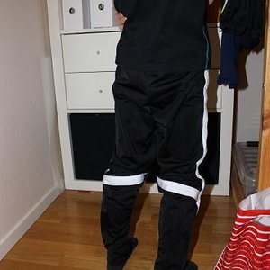 Girl with black/white adidas pants