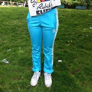 Girl with turquoise/white adidas pants