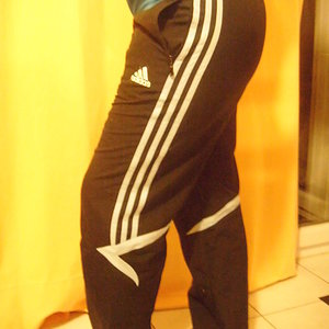 Girl with black/white adidas pants