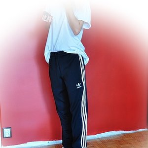 Girl with black/white adidas pants