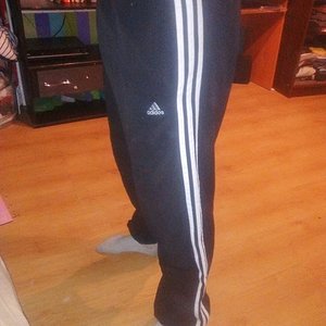 Girl with black/white adidas pants