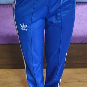 Girl in Adidas blue/white pants