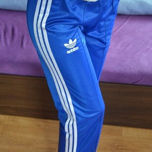 Girl in Adidas blue/white pants