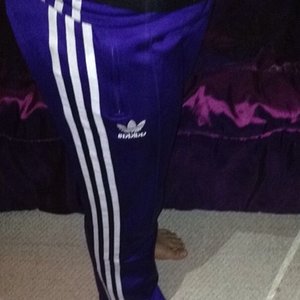 Girl in Adidas purple pants