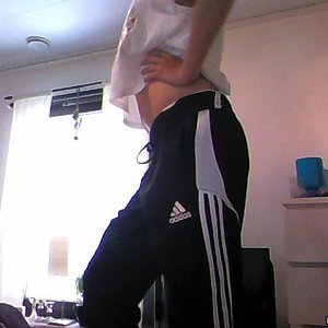 Girl with black/white adidas pants