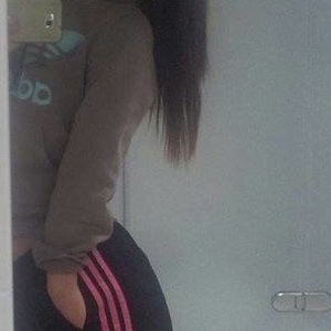 Girl in Adidas pants black / pink