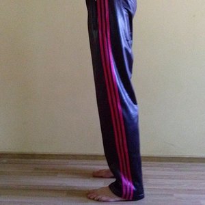 Girl in Adidas pants black / red
