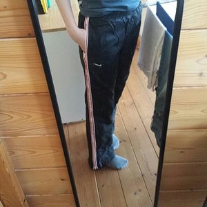 Girl in Nike nylon pants