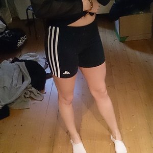 Athletic girl in Adidas shorts