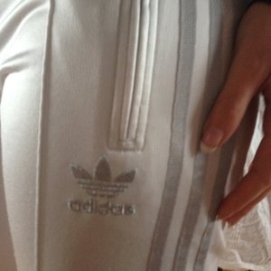 adidas white pants closeup