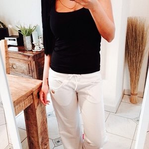 Girl in adidas white pants