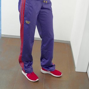 Girl with adidas RESPECT ME shiny purple pants