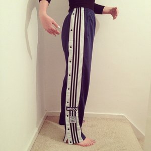 Girl in Adidas poppers pants