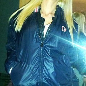 smoking wife in her nylon jacket