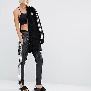 Hot blonde in Adidas Chile pants front view