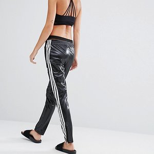 Hot blonde in Adidas Chile pants back view