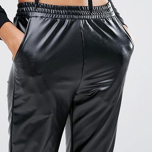 Tall girl in shiny pants front close up