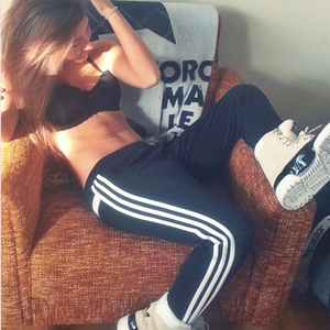 Topless girl in adidas pants