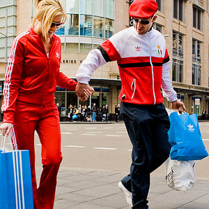 A couple in adidas track suits